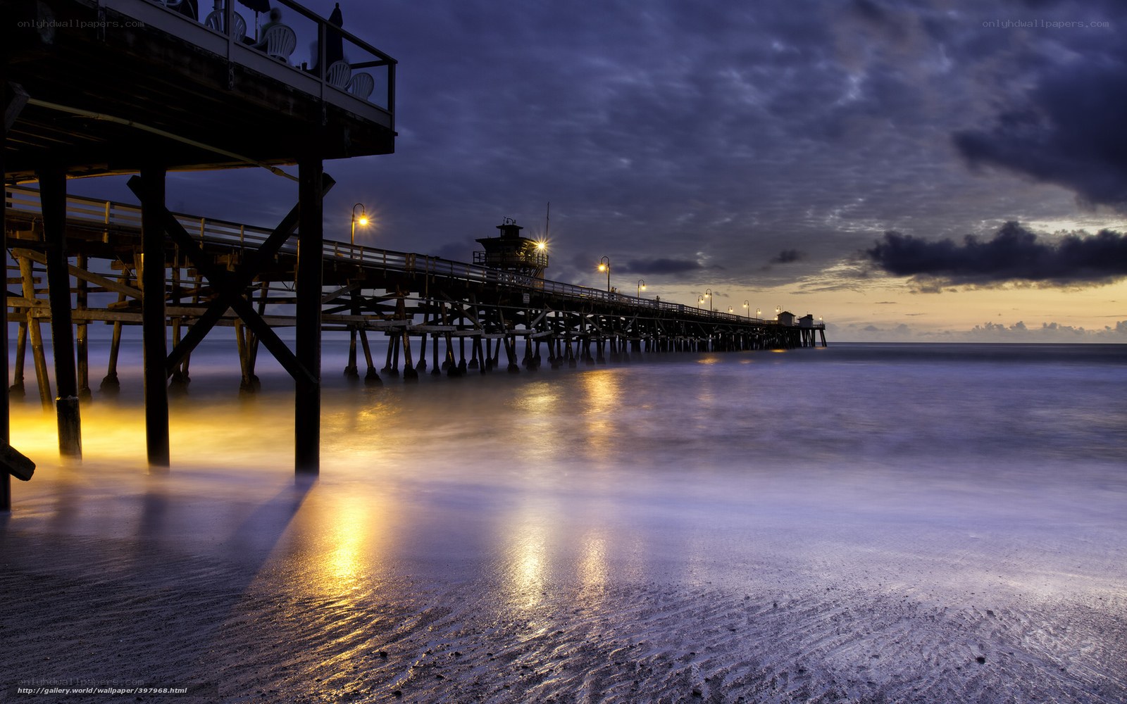 Pier at dusk with glowing lights