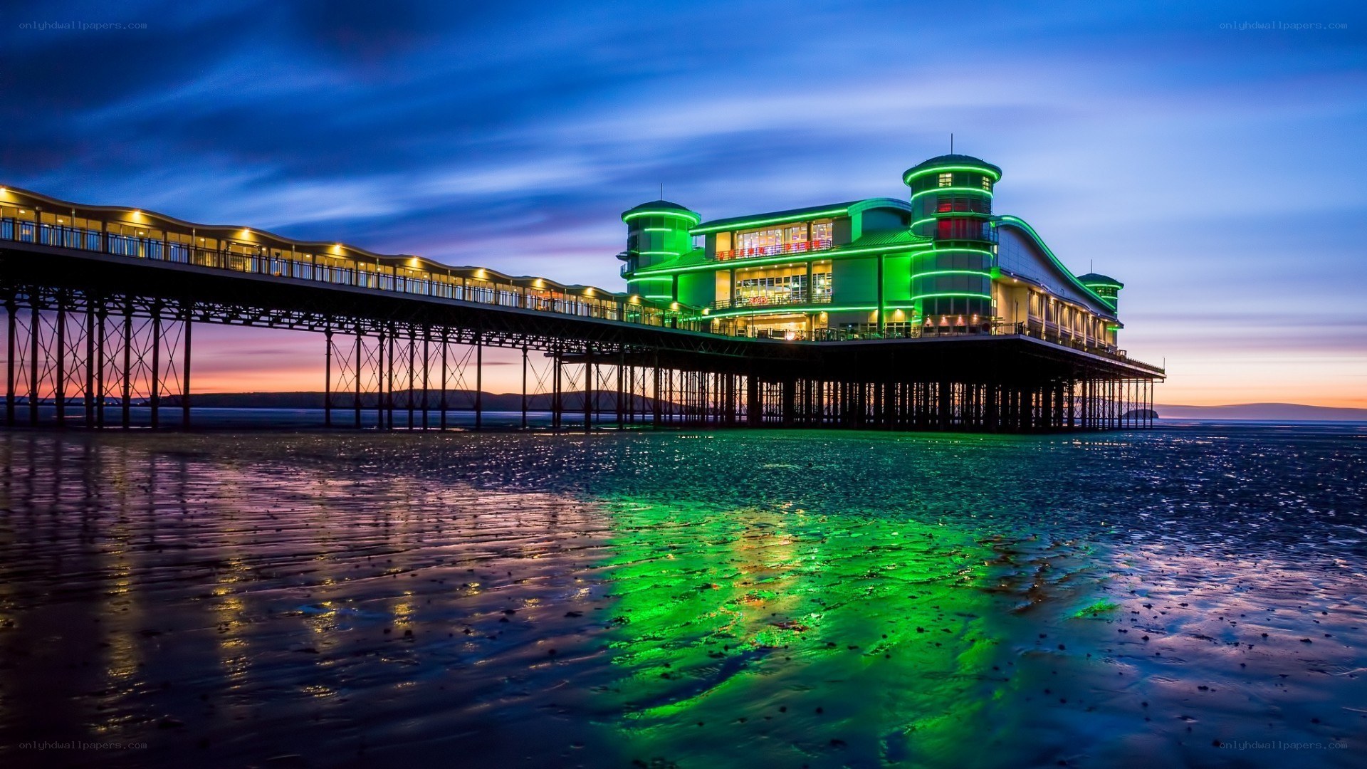 Pier at dusk with green lights