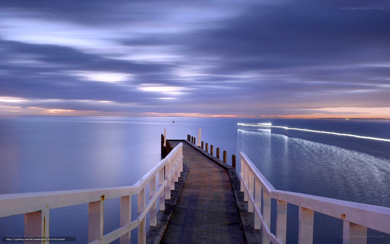 Pier at dusk with light trails