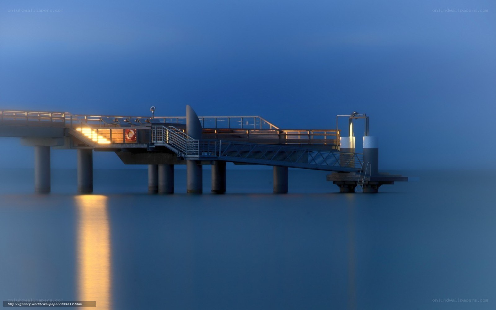 Pier at dusk with warm lights