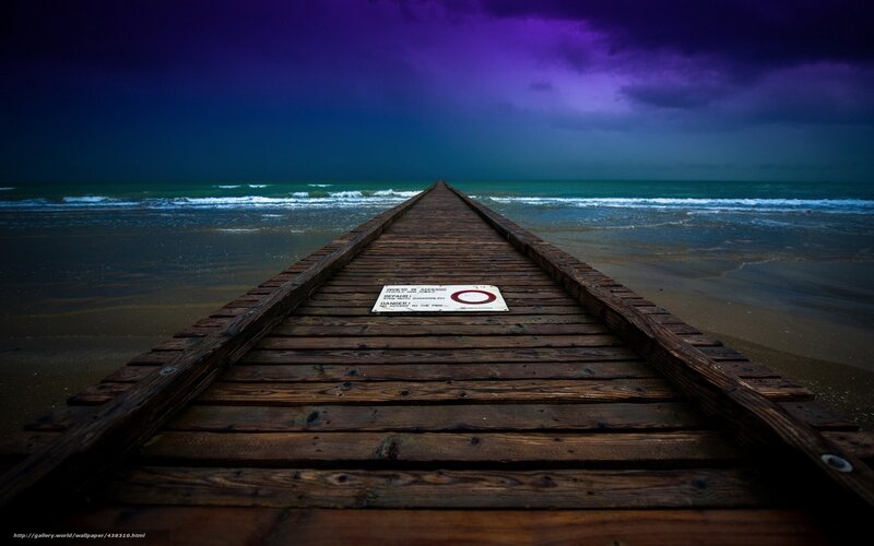 Pier at stormy beach