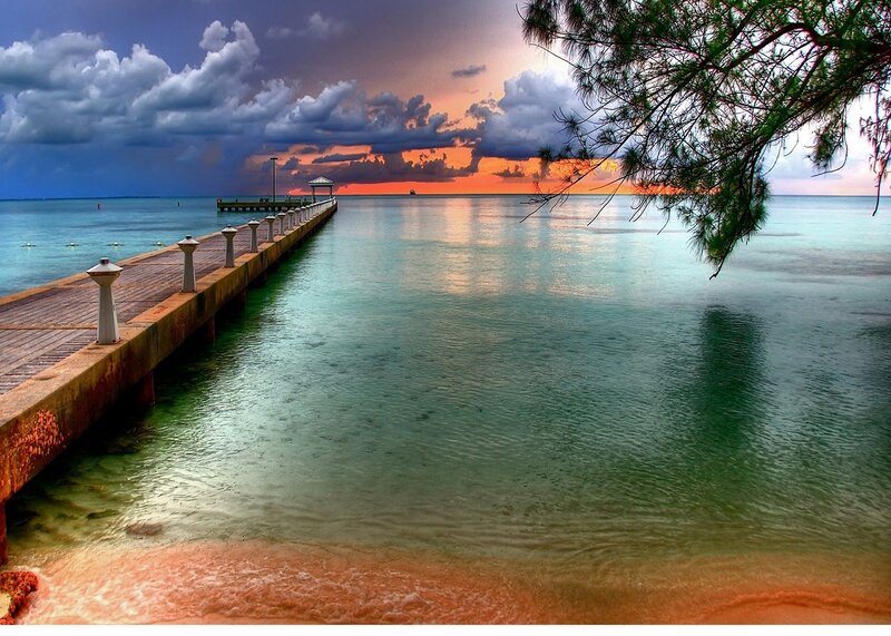 Pier at Sunset — Blue, Dramatic, Photograph, Clouds, Tree Branch, Ocean