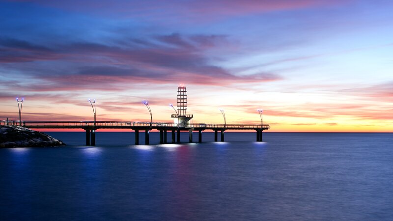 Pier at Sunset — Blue, Serene, Photograph, Sky, Ocean, Lighthouse