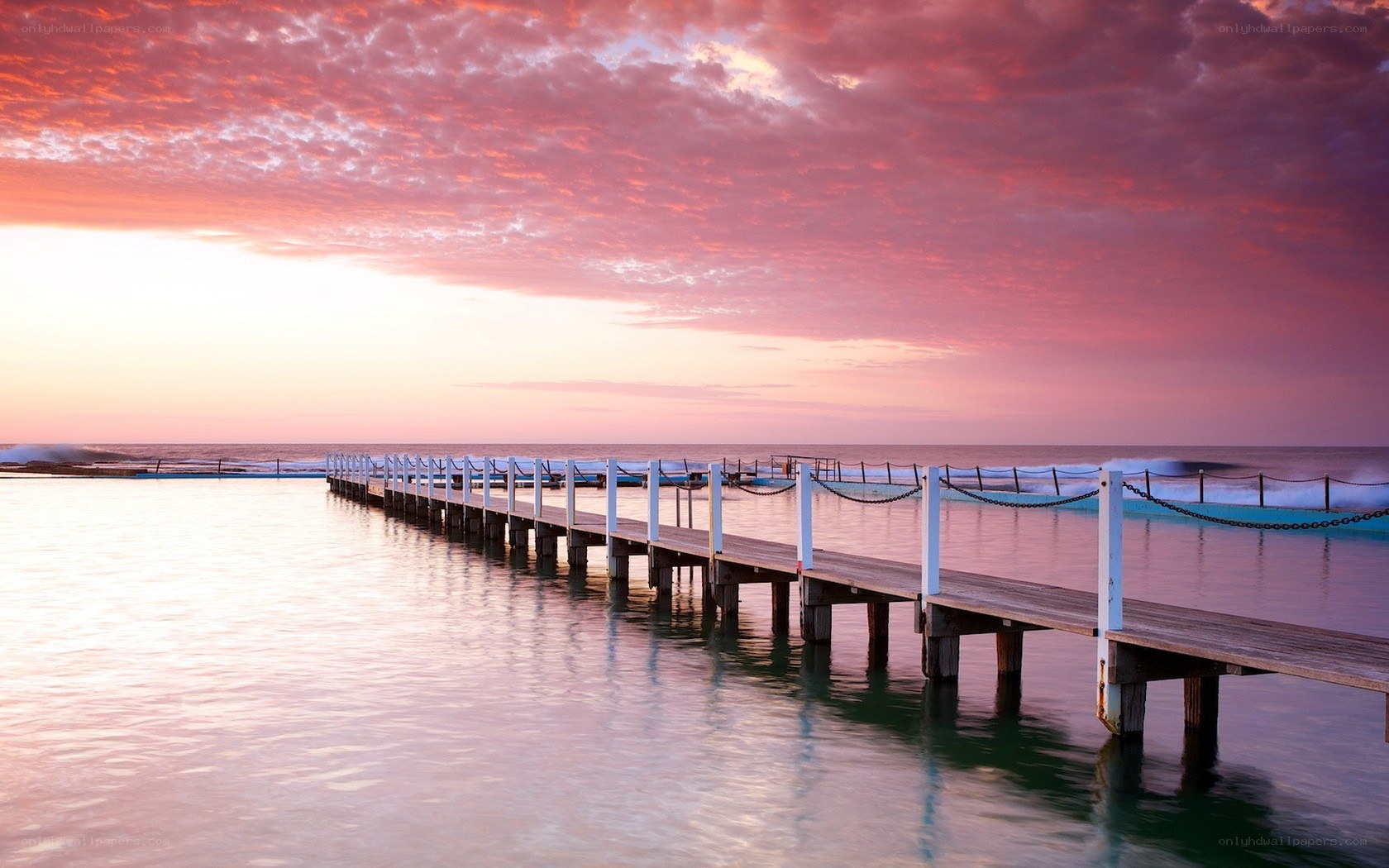 Pier at sunset by the ocean