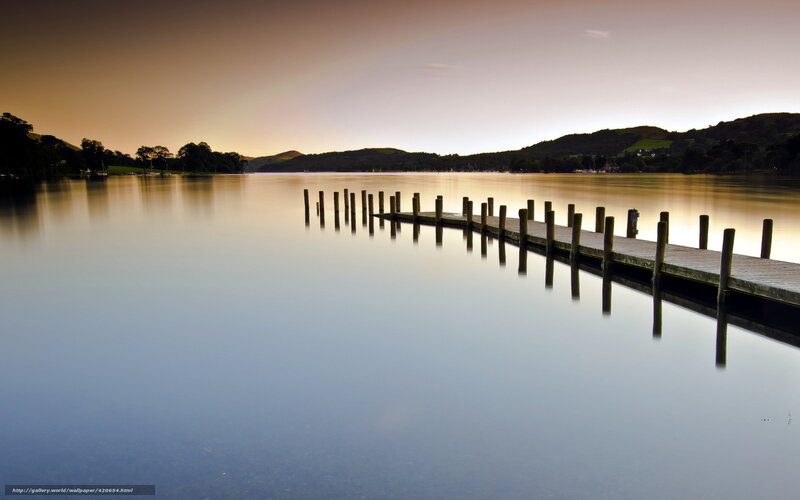 Pier at sunset on a calm lake