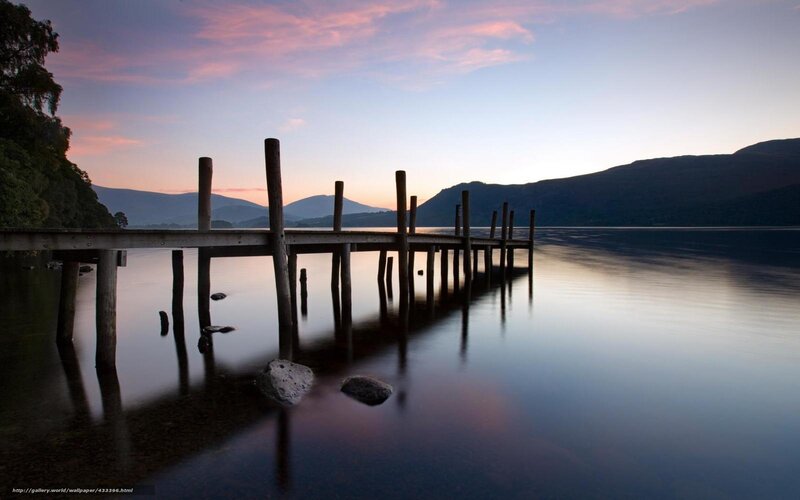 Pier at sunset on a calm lake