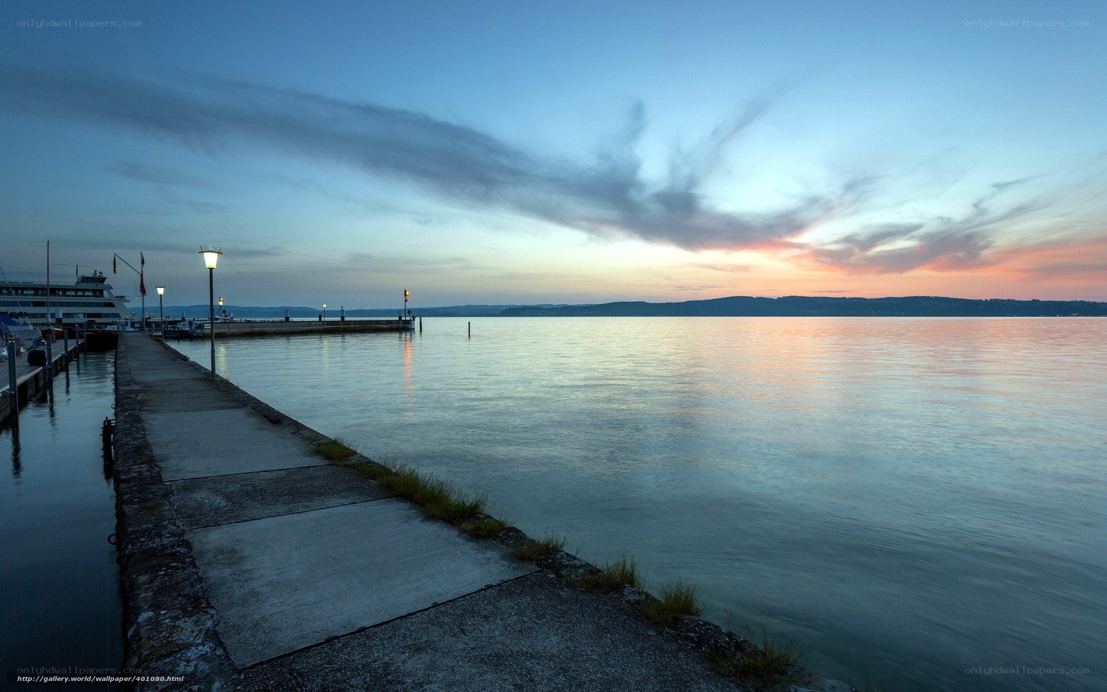 Pier at sunset on a calm lake