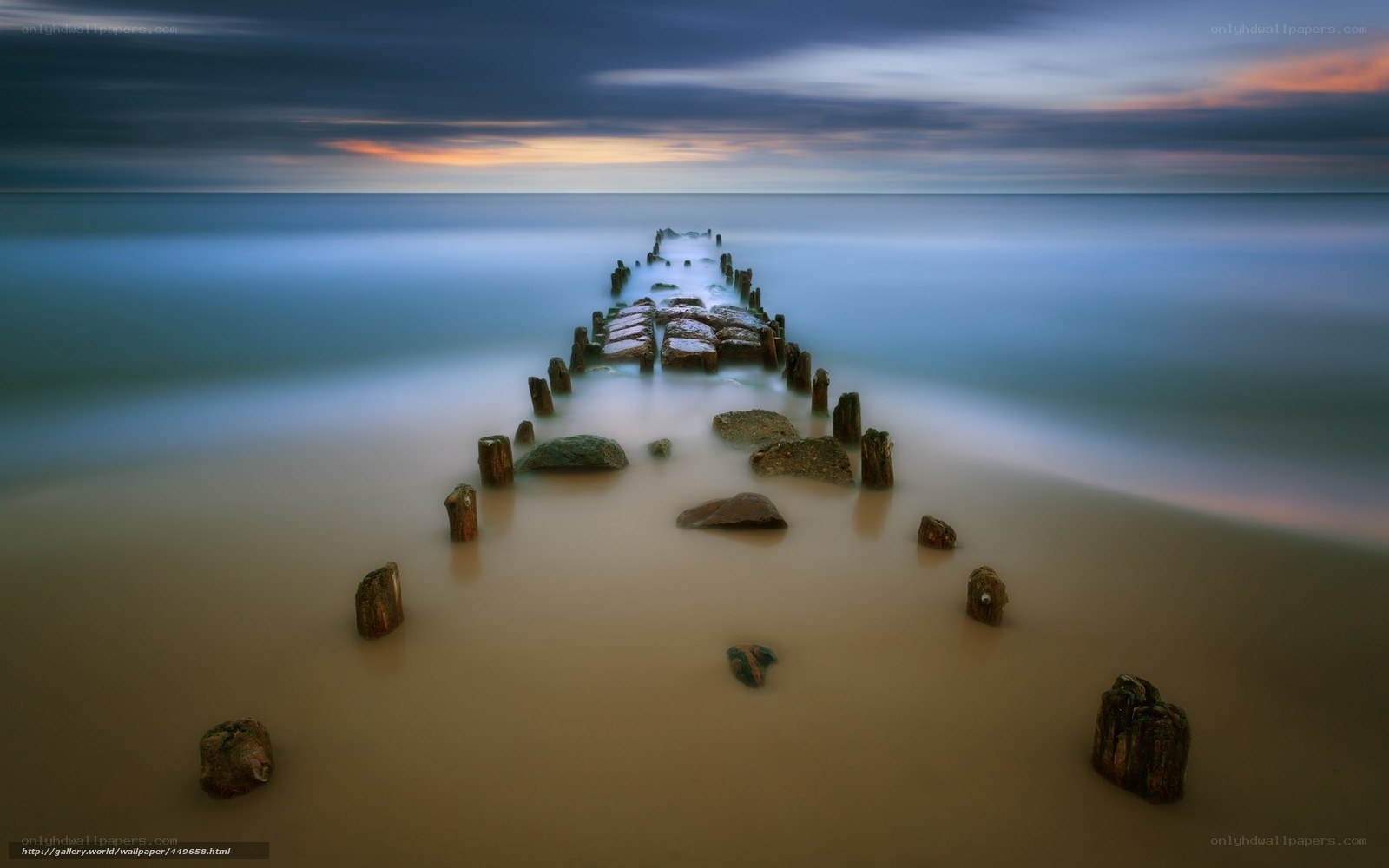 Pier at sunset on calm sea