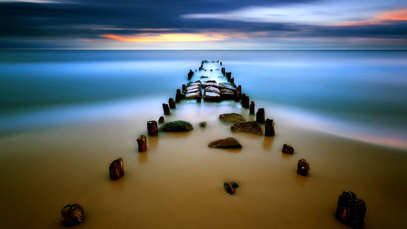 Pier at sunset on calm sea