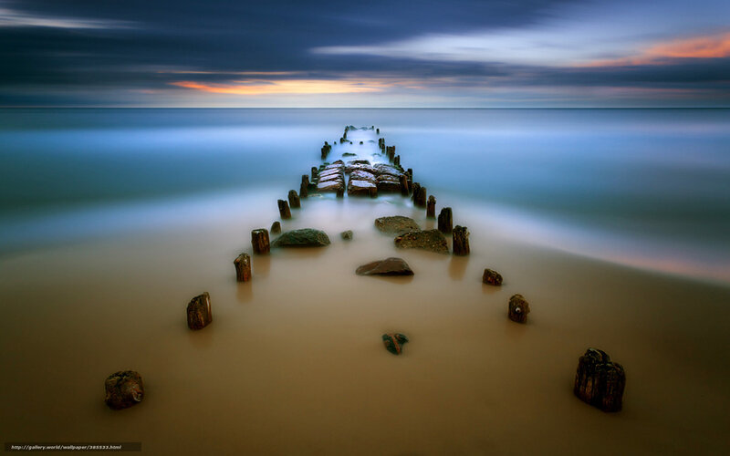 Pier at sunset on calm sea