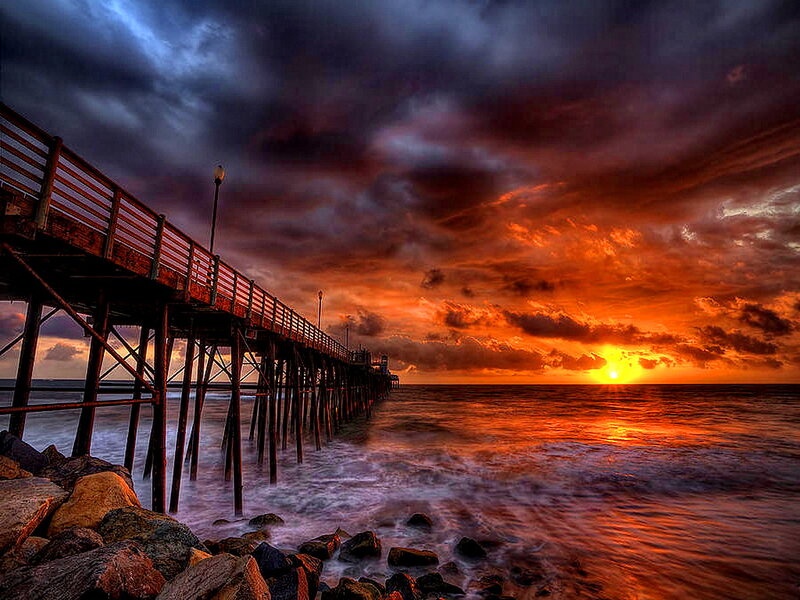 Pier at Sunset — Orange, Dramatic, Photograph, Ocean, Clouds, Rocks