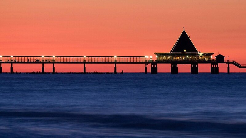 Pier at Sunset — Orange, Serene, Photograph, Ocean, Sky, Building, Blue