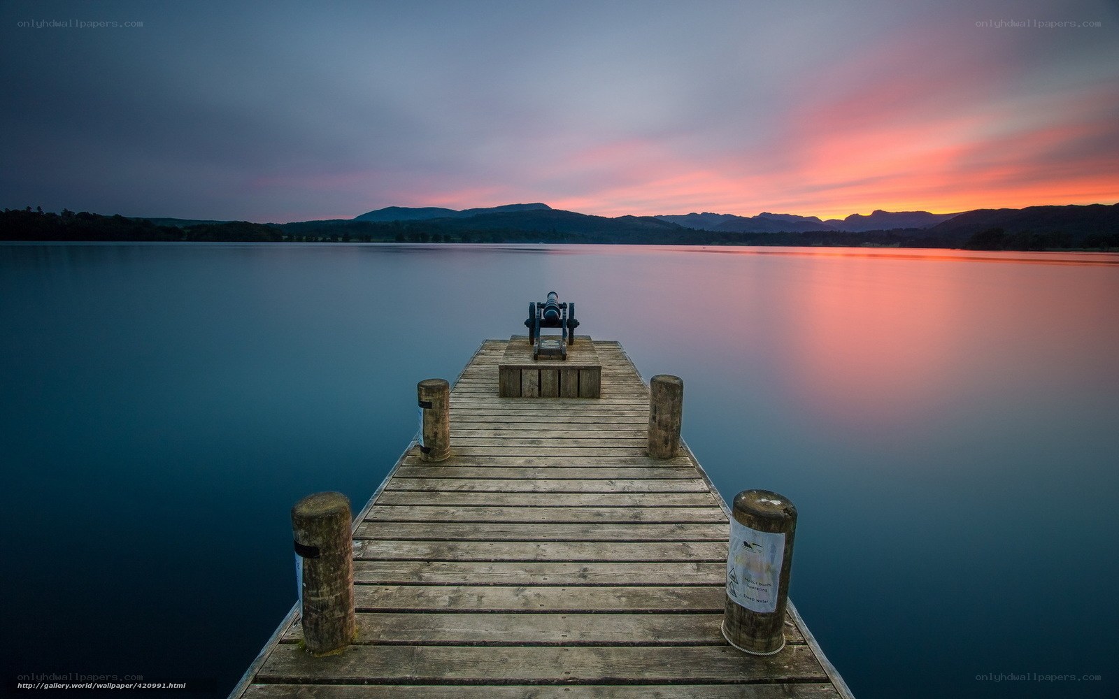 Pier at sunset over a lake