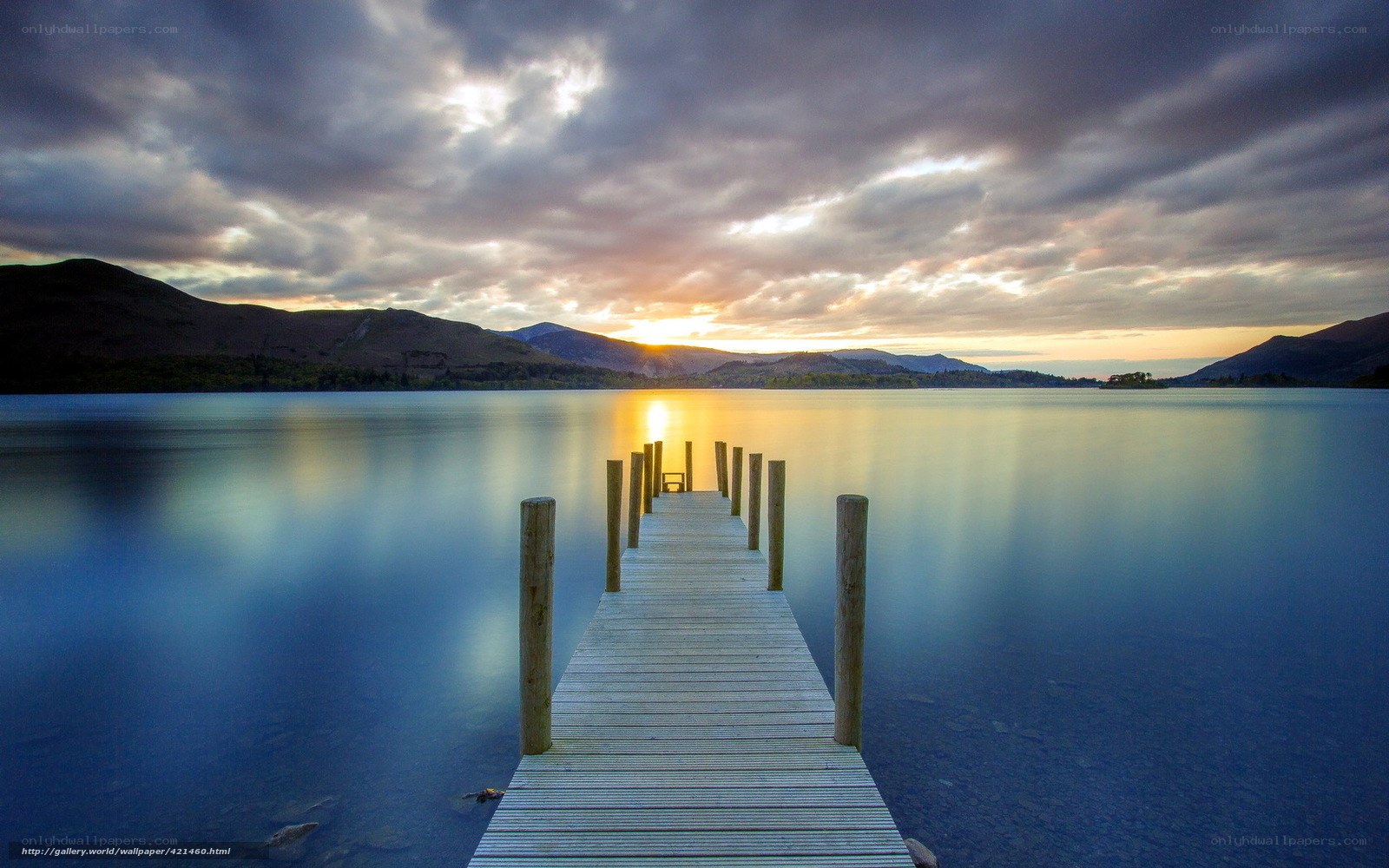 Pier at sunset over a lake