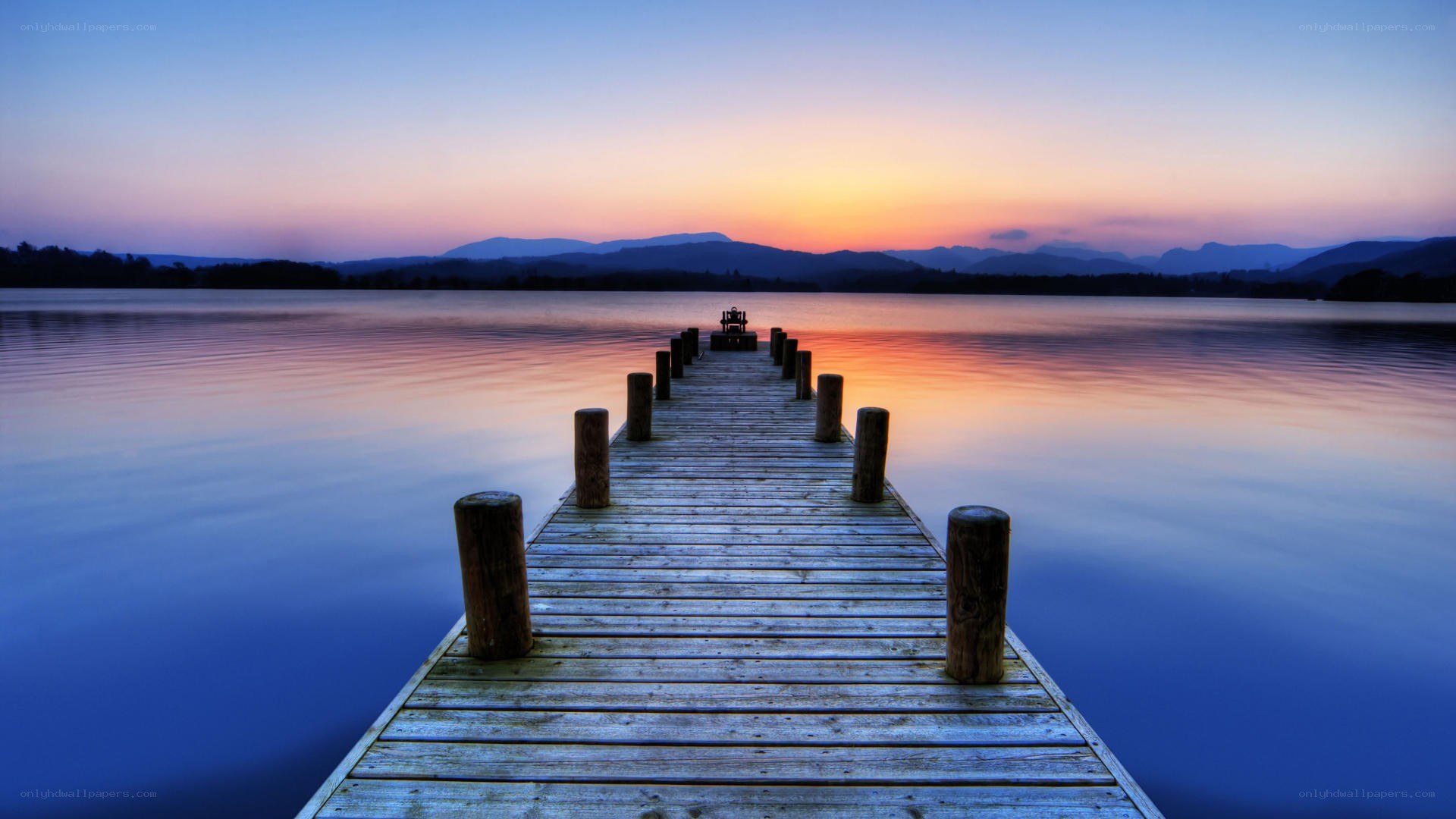 Pier at sunset over a lake