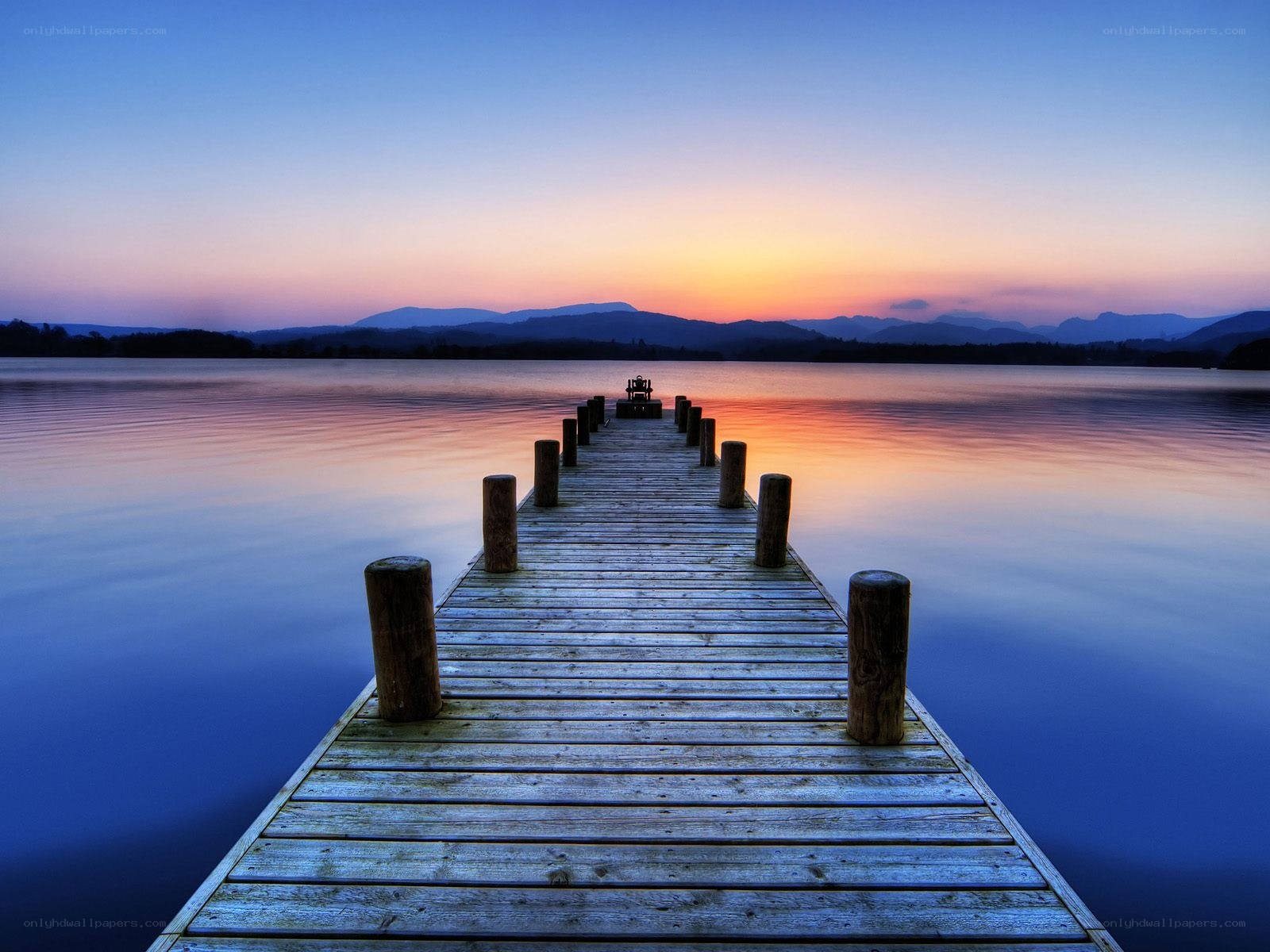 Pier at sunset over a lake