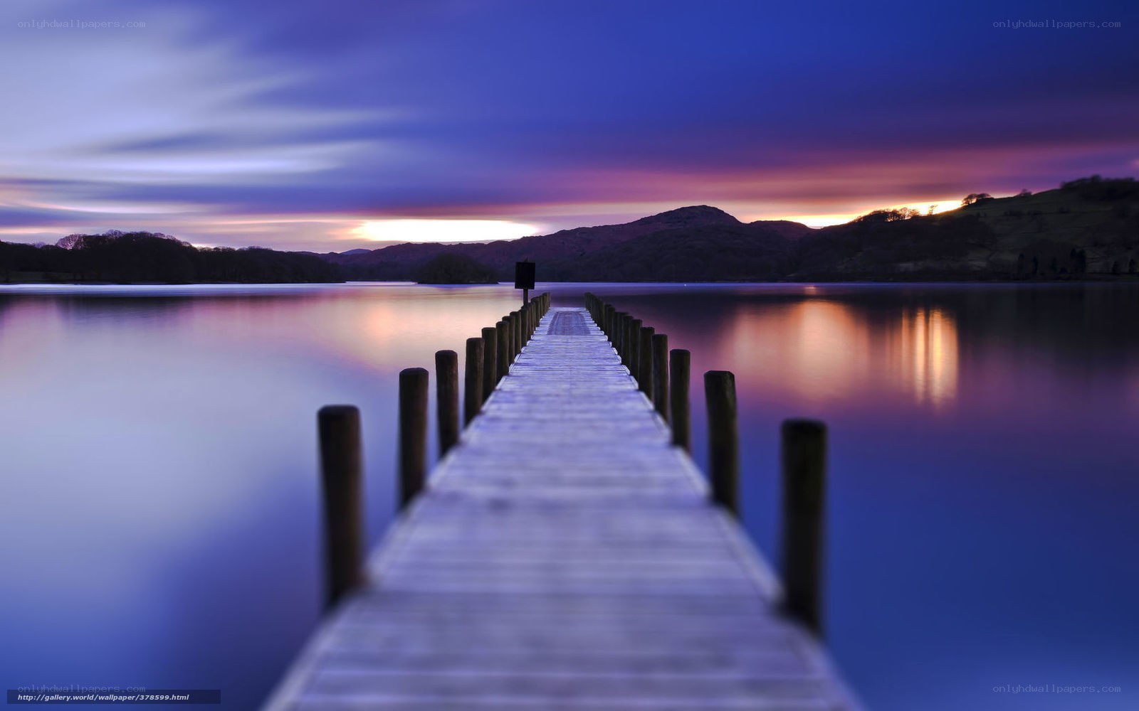 Pier at sunset over a lake