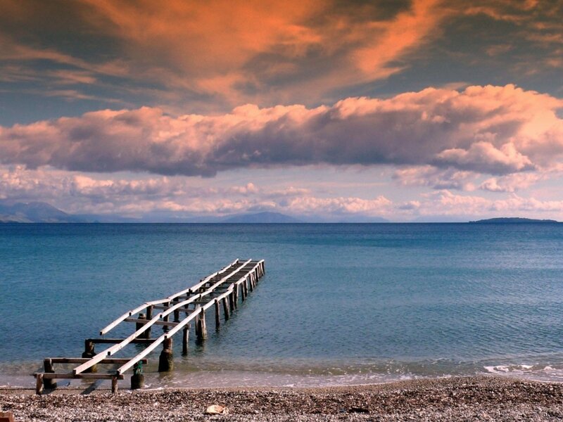 Pier at sunset over calm sea
