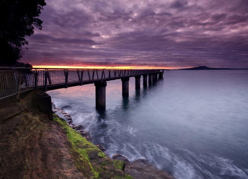 Pier at sunset over calm water