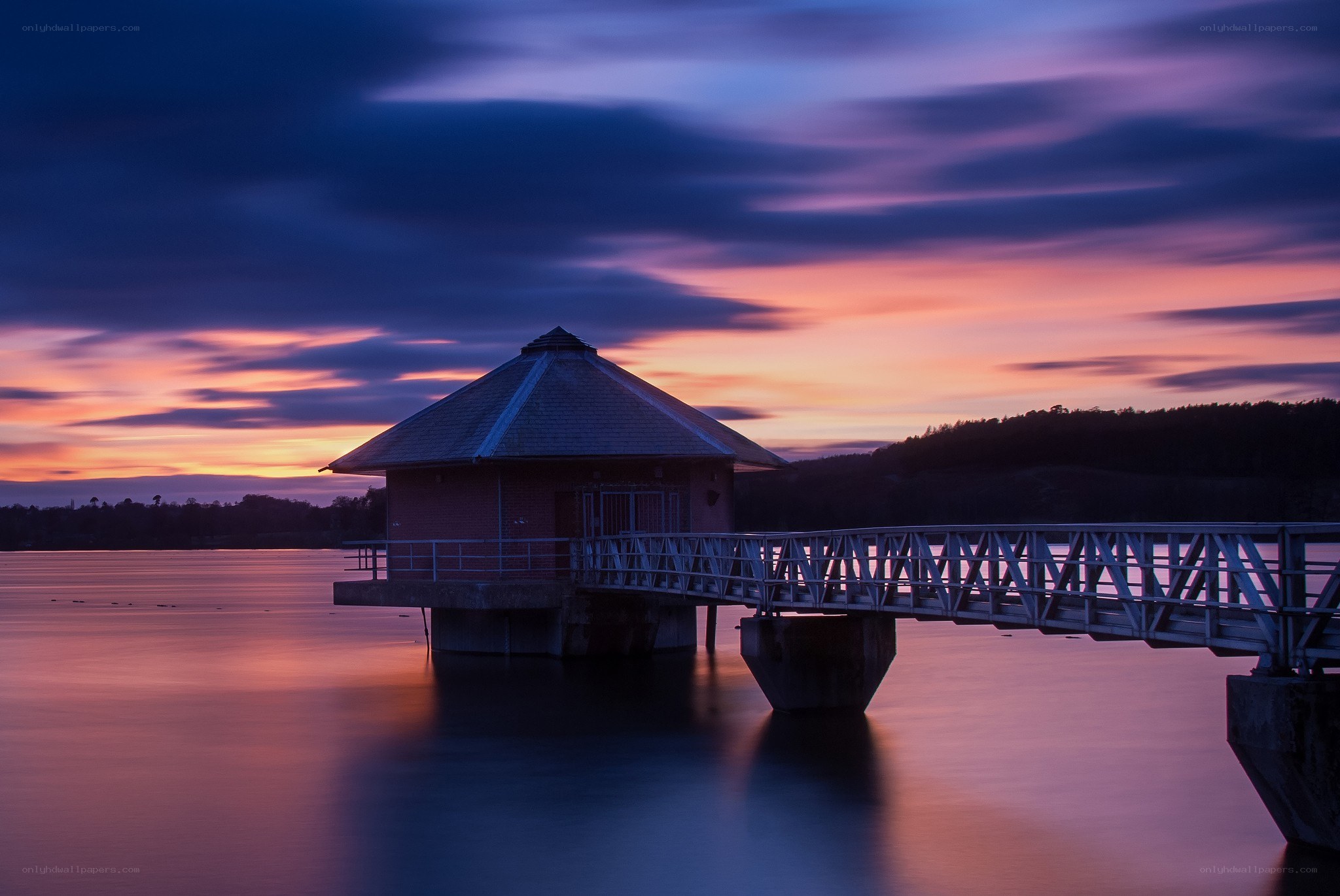 Pier at sunset over lake