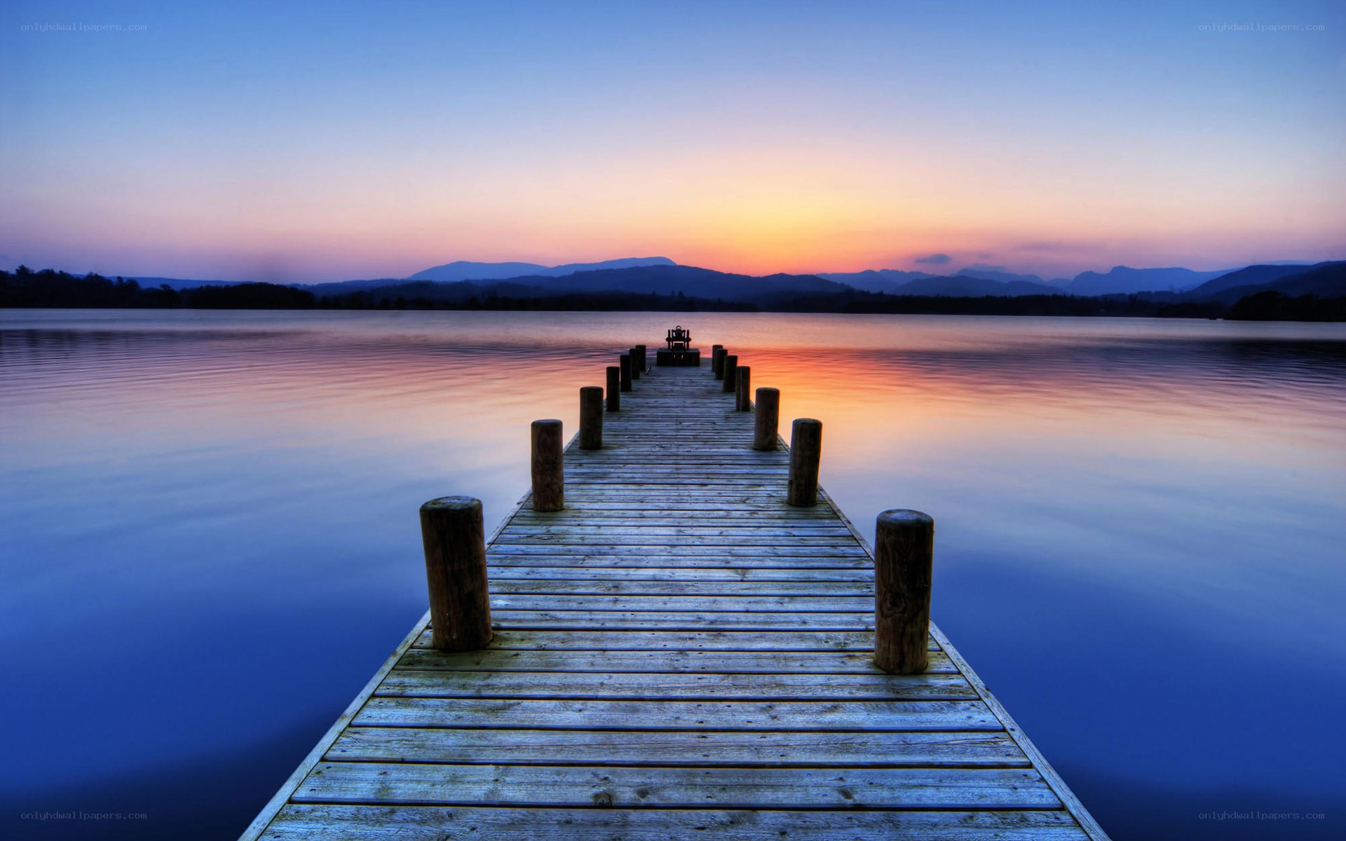 Pier at sunset over lake
