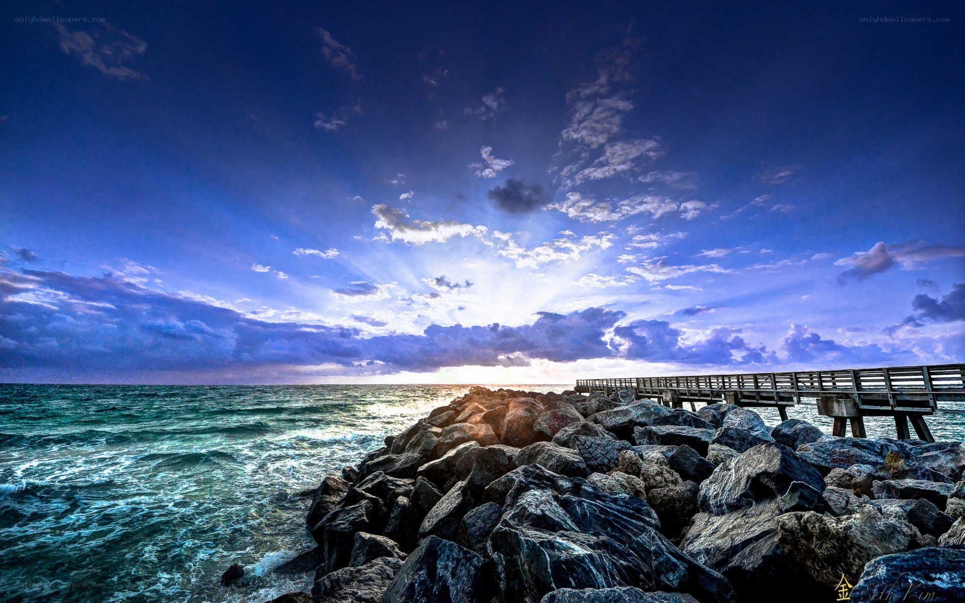 Pier at sunset over ocean