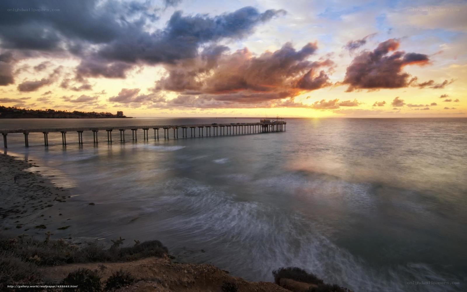 Pier at sunset over ocean