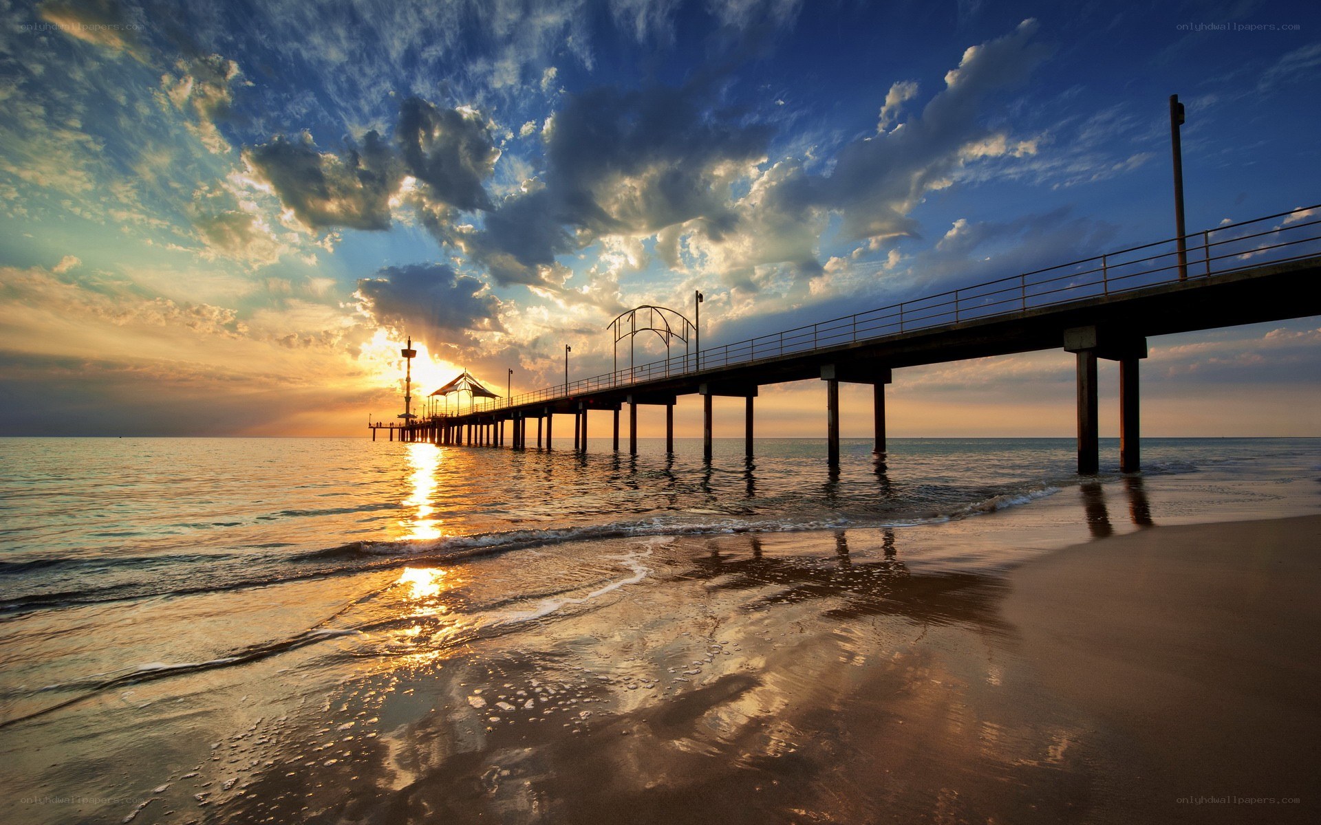Pier at sunset over the ocean