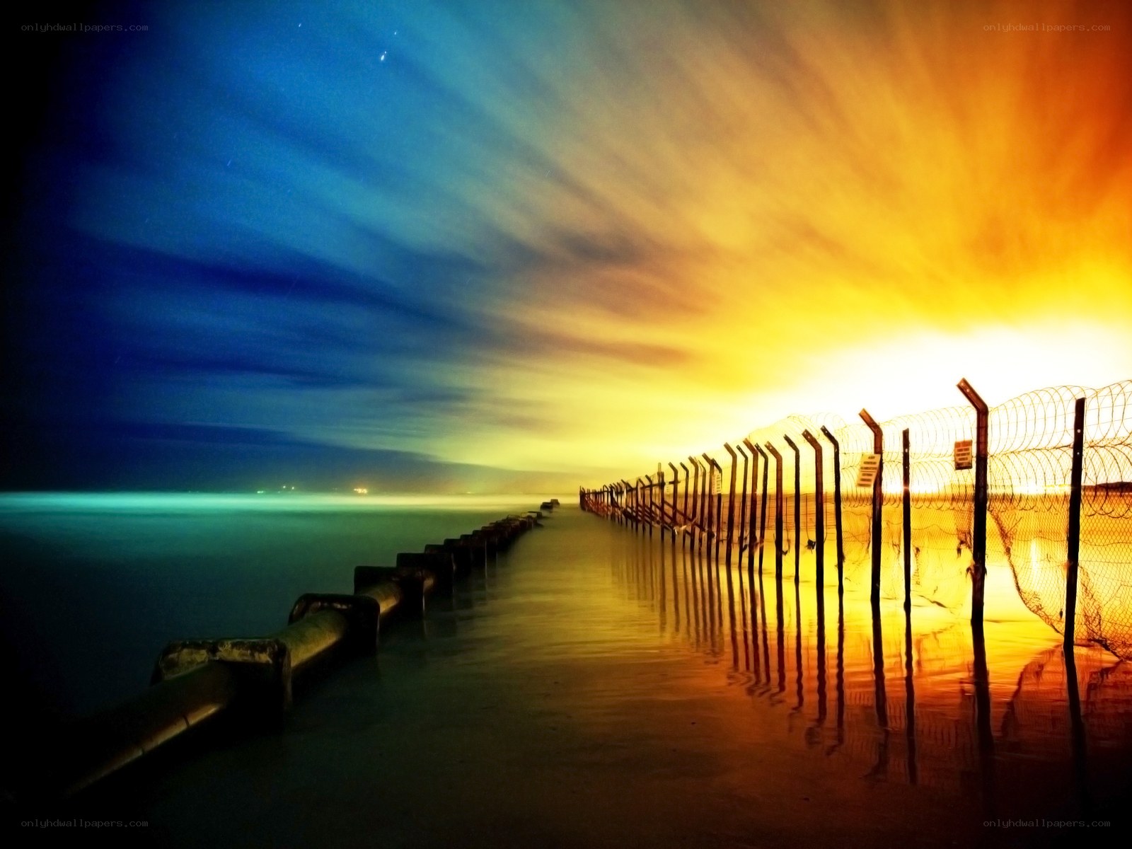 Pier at sunset with barbed wire