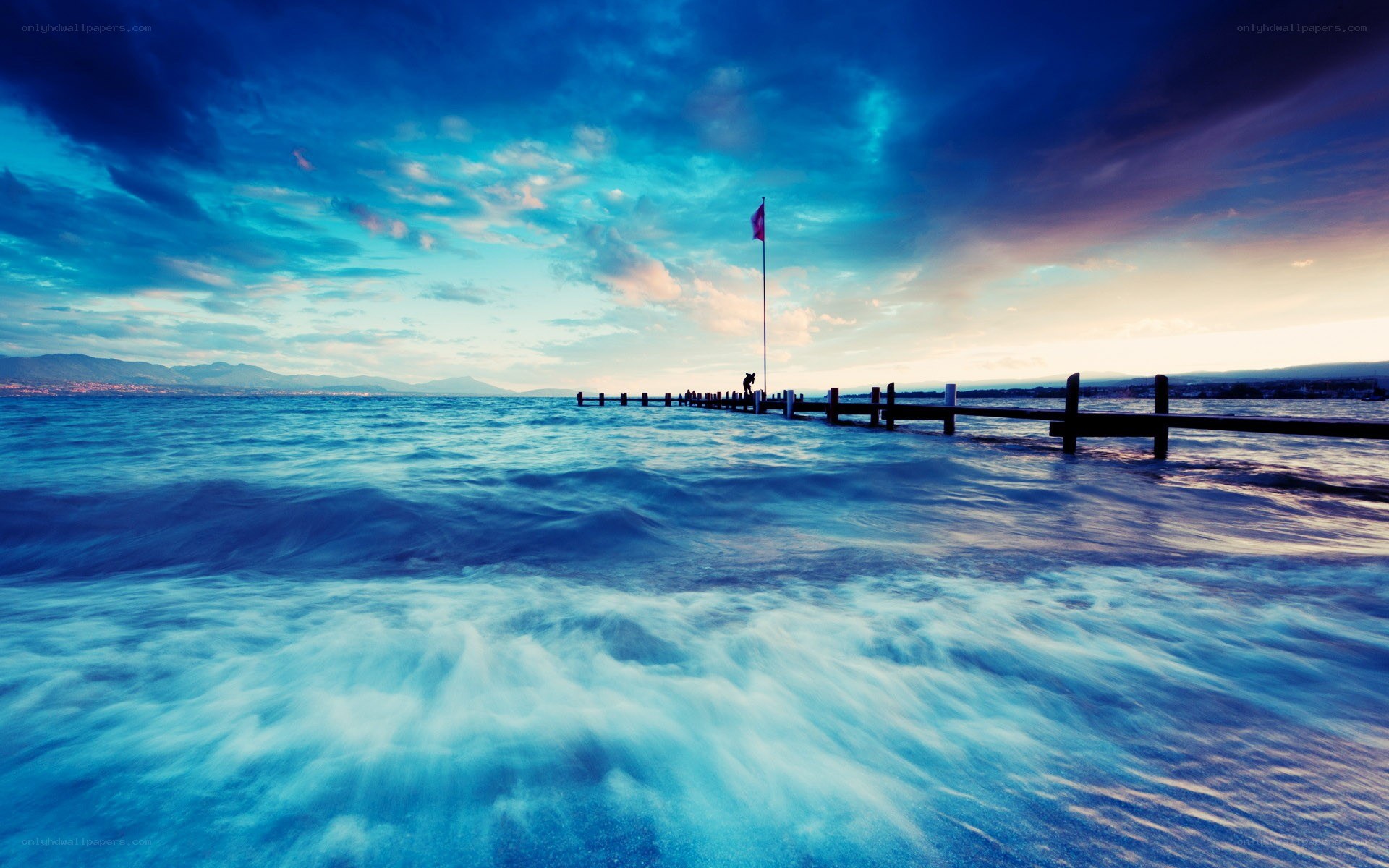 Pier at sunset with blue sky