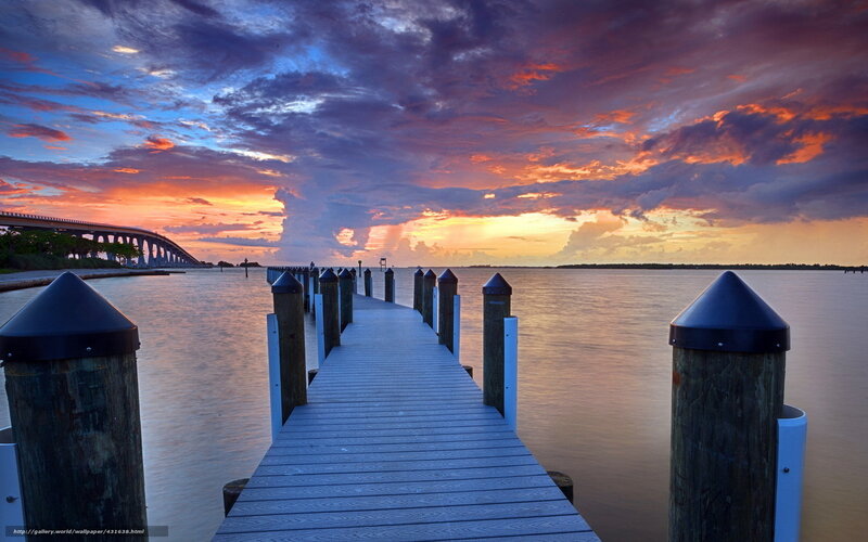 Pier at sunset with bridge