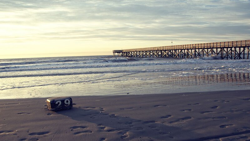 Pier at sunset with buoy