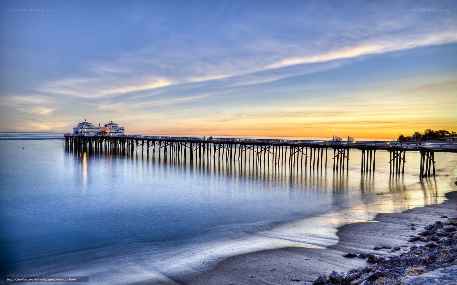 Pier at sunset with calm water