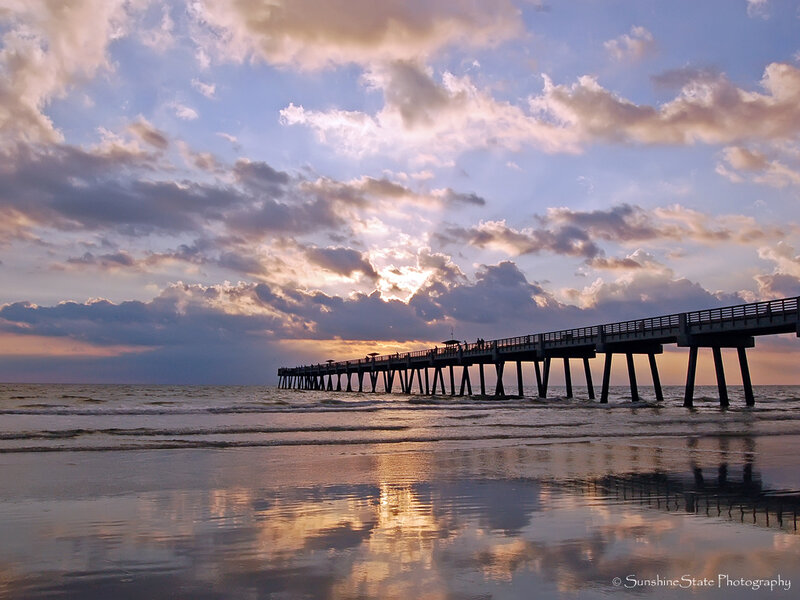 Pier at sunset with cloudy sky