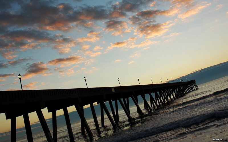 Pier at sunset with colorful sky