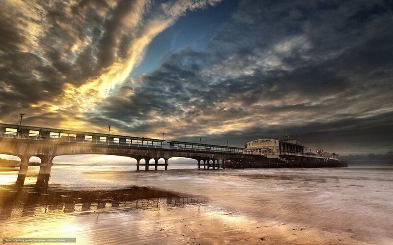 Pier at sunset with dramatic clouds