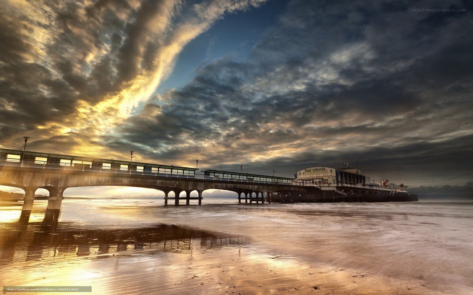 Pier at sunset with dramatic clouds