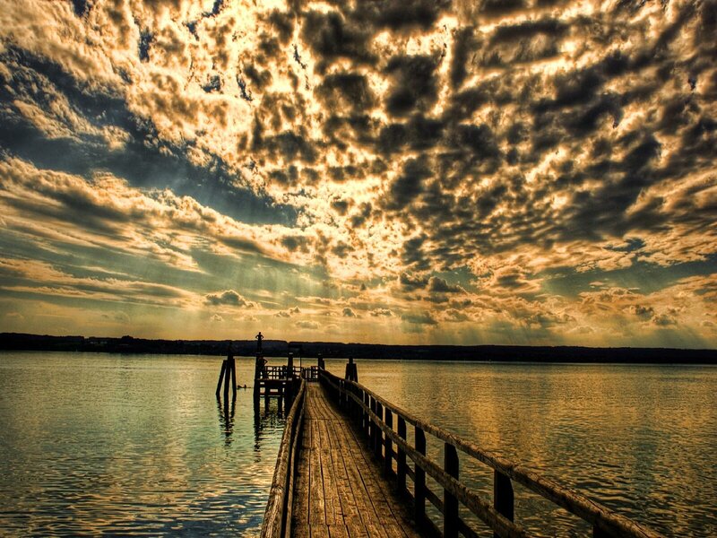 Pier at sunset with dramatic clouds