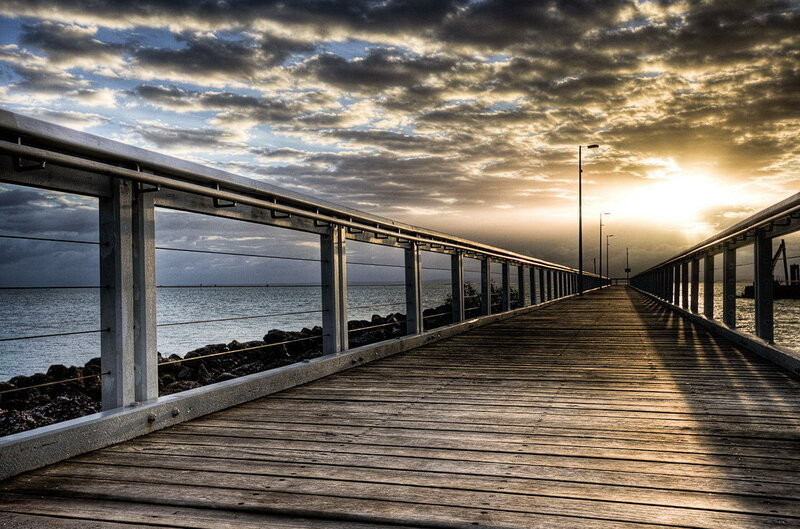 Pier at sunset with dramatic sky