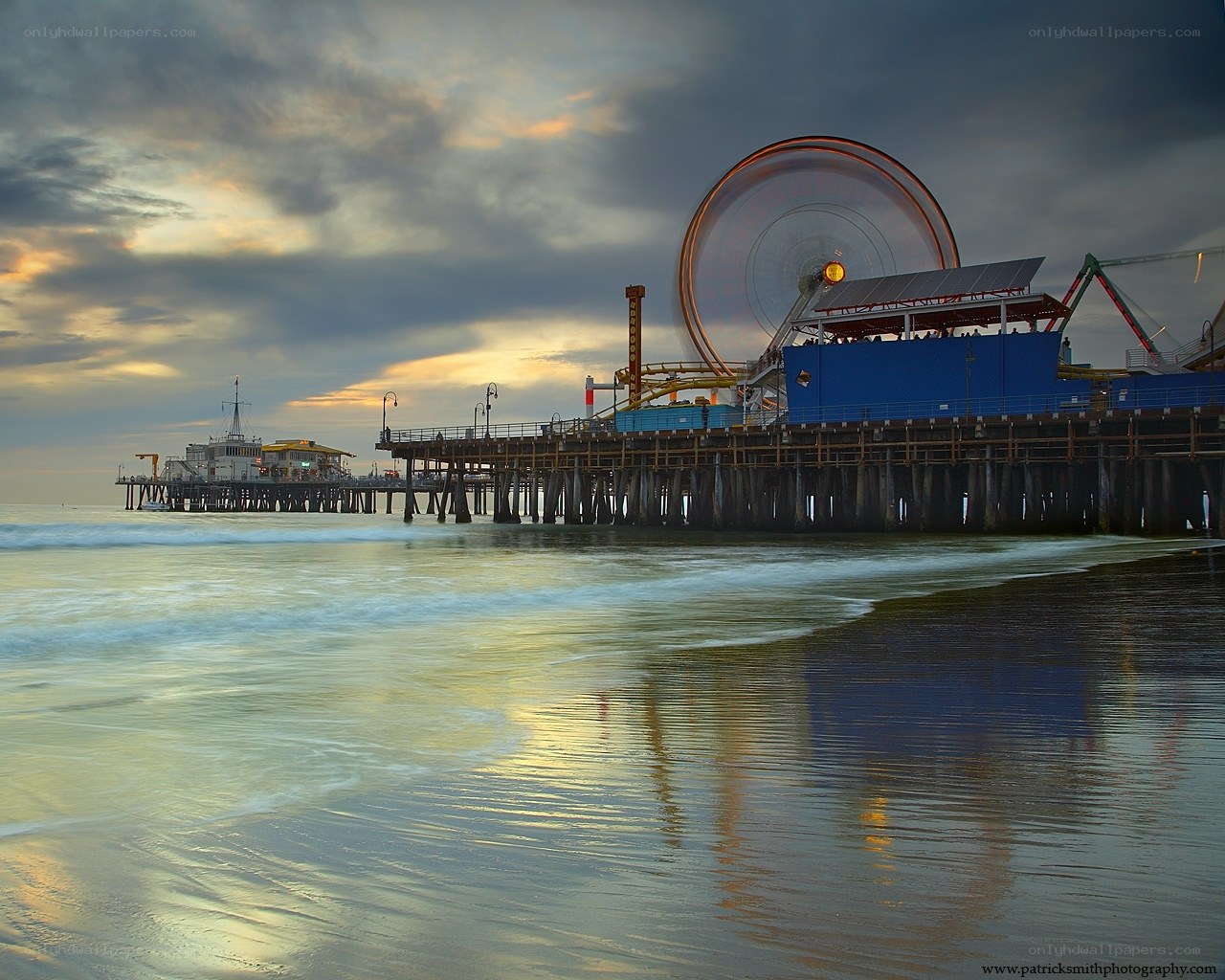 Pier at sunset with Ferris wheel