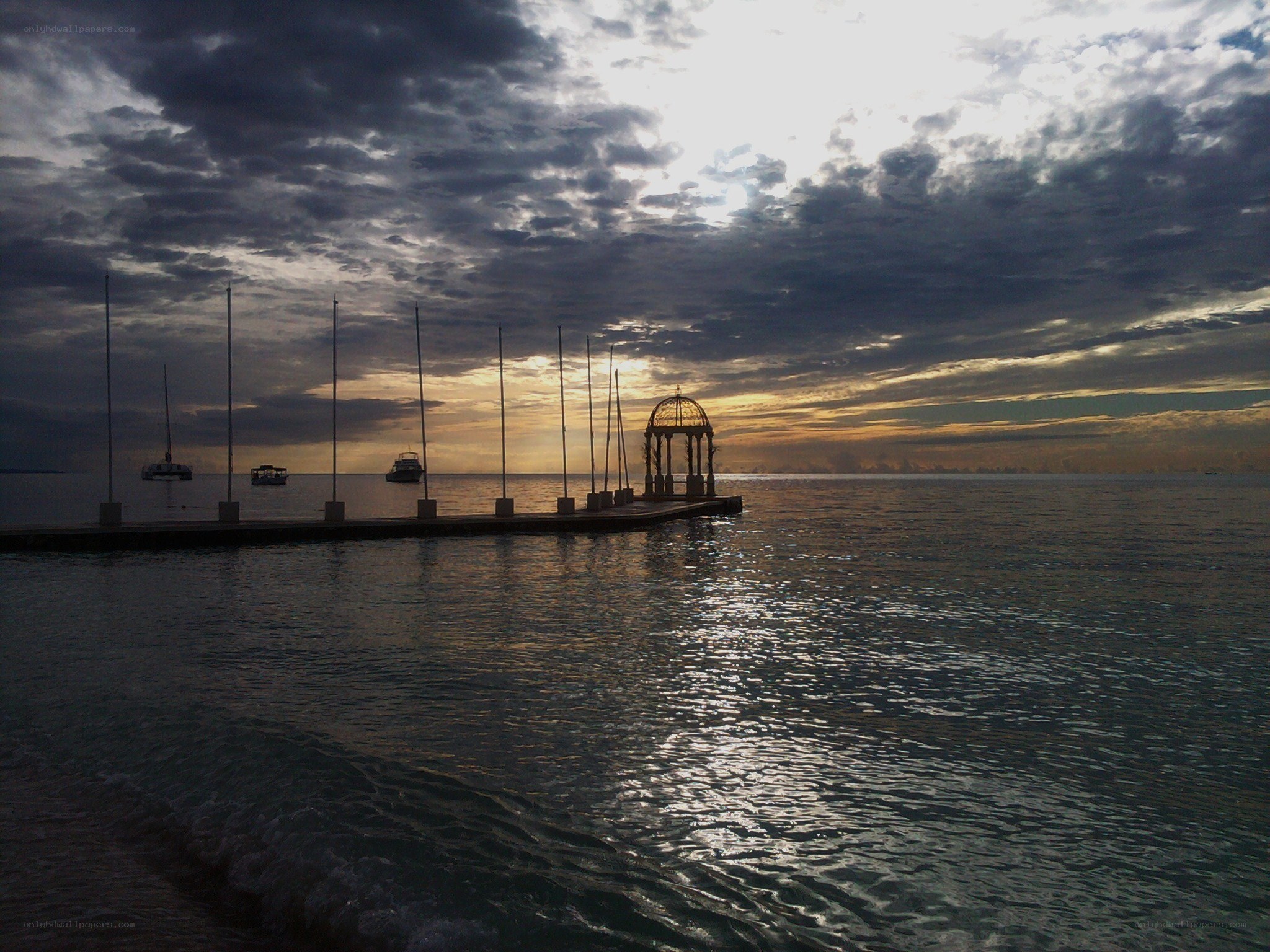 Pier at sunset with gazebo
