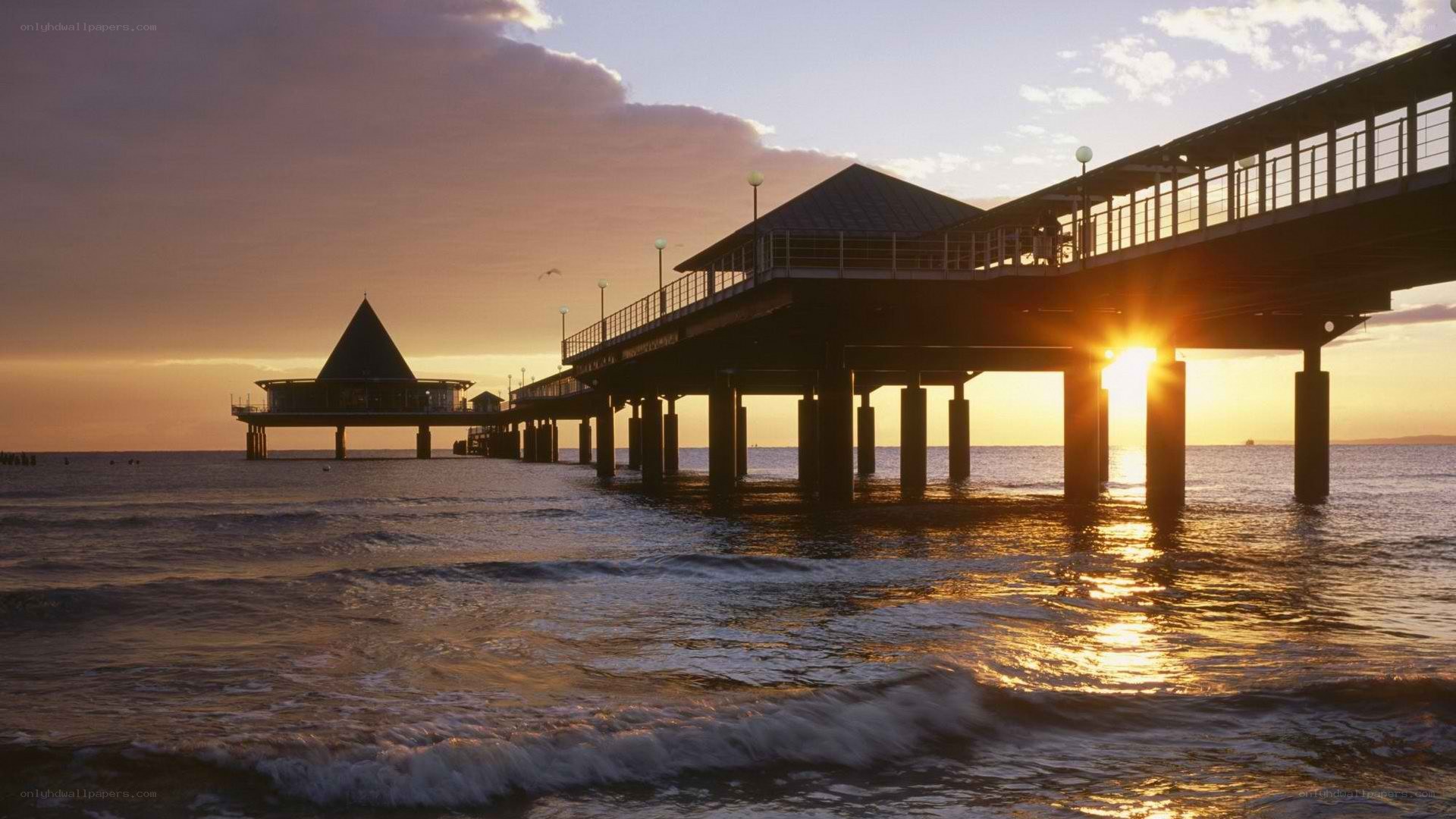 Pier at sunset with golden light