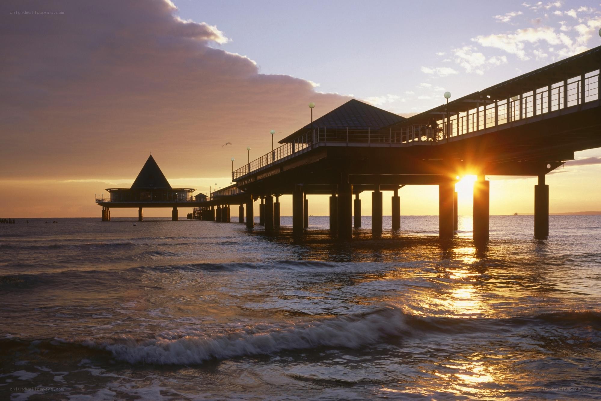 Pier at sunset with golden light