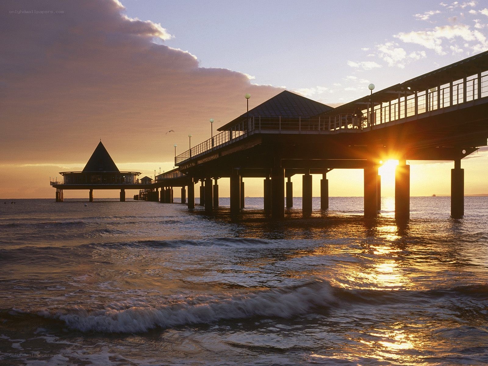 Pier at sunset with golden light