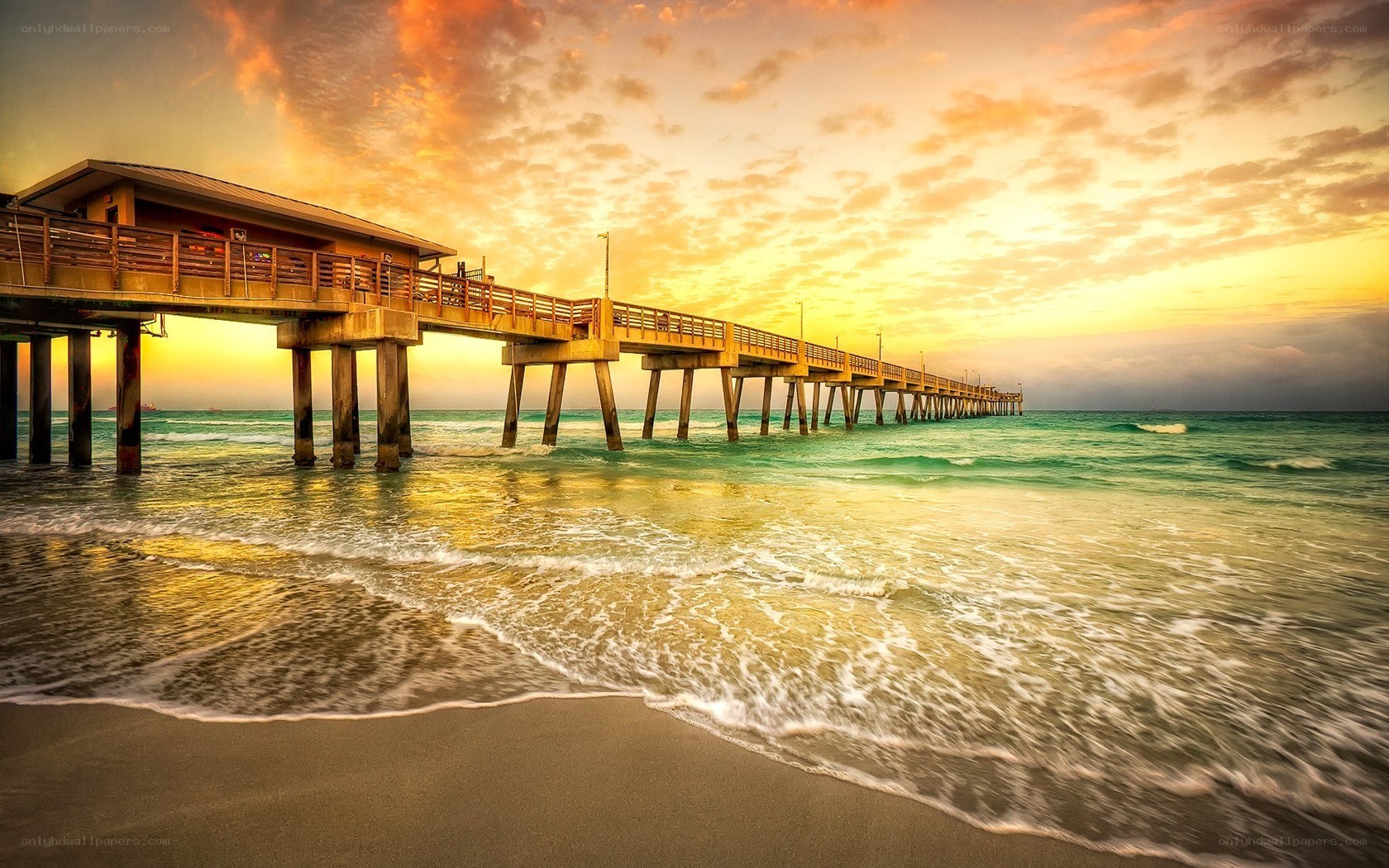 Pier at sunset with golden sky