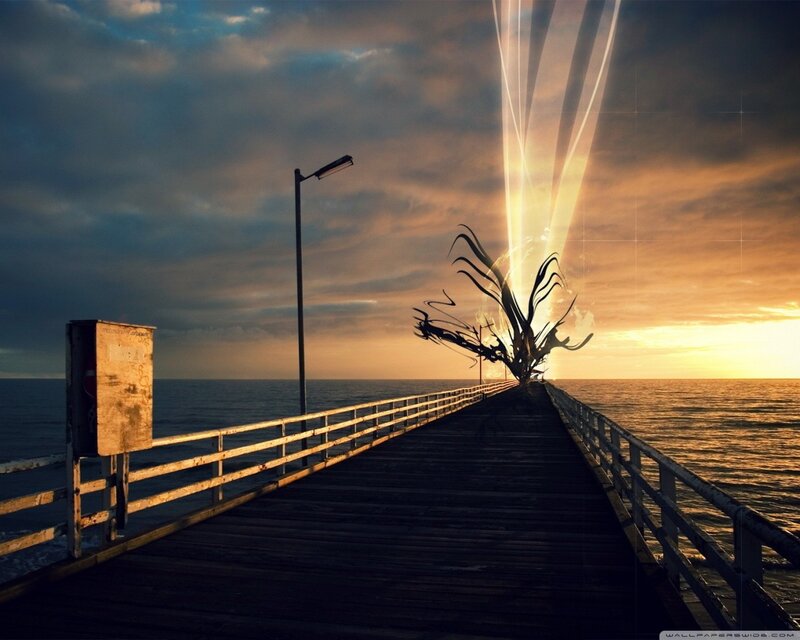 Pier at sunset with light beams
