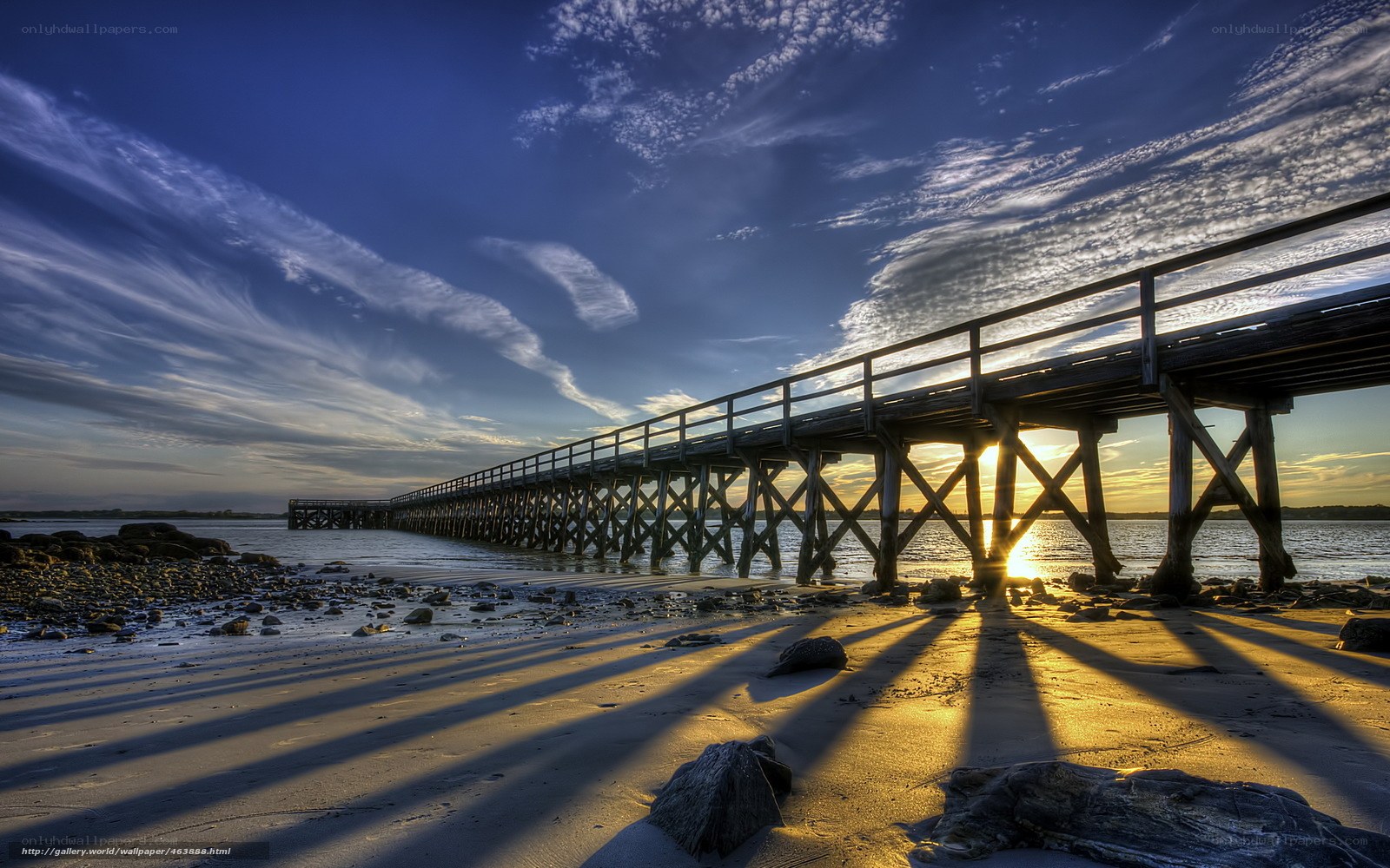 Pier at sunset with long shadows