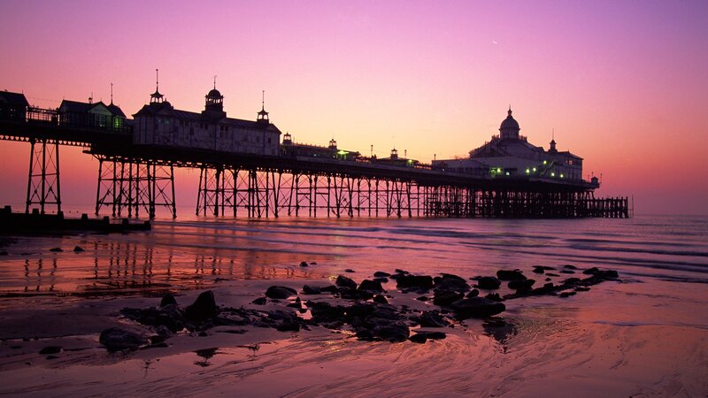 Pier at sunset with moon