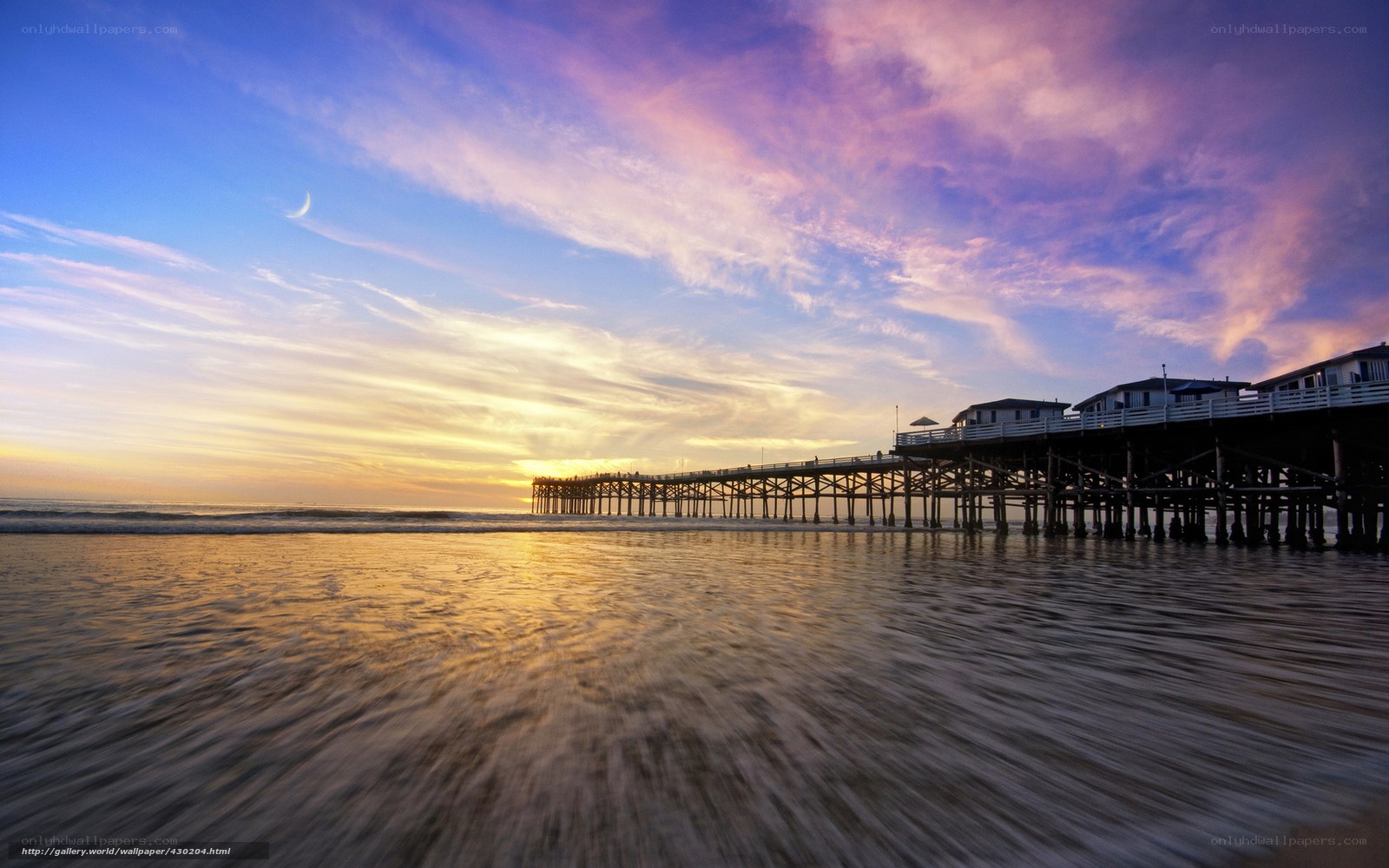Pier at sunset with moon