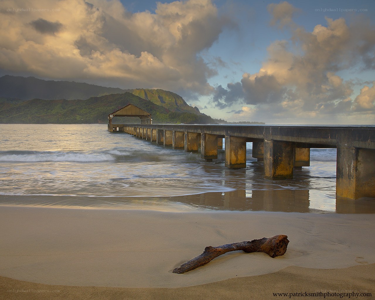 Pier at sunset with mountains